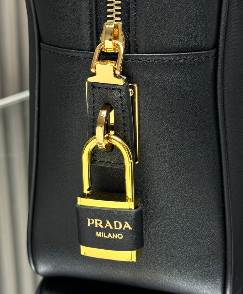 Large Re-Nylon And Leather Top-handle Bag With Padlock