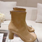 Atomic Glossed-Leather Ankle Boots