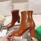 Atomic Glossed-Leather Ankle Boots