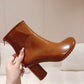 Atomic Glossed-Leather Ankle Boots